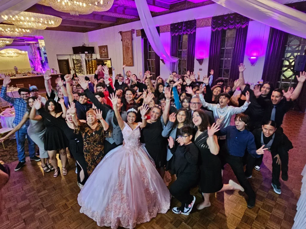 Guests celebrating on the dance floor at a quinceanera.