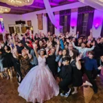 Guests celebrating on the dance floor at a quinceanera.