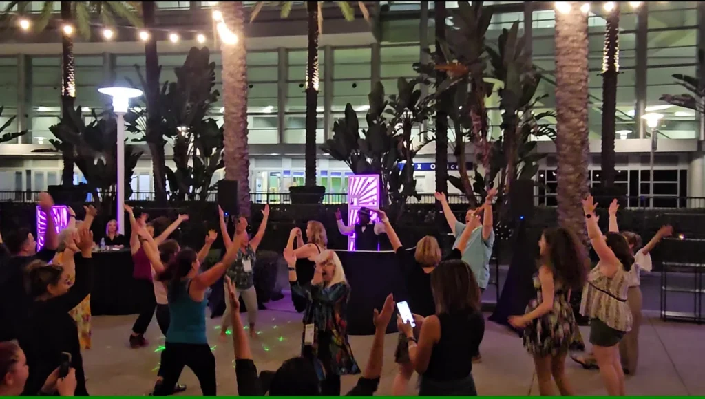 Corporate event guests participating on the dance floor.